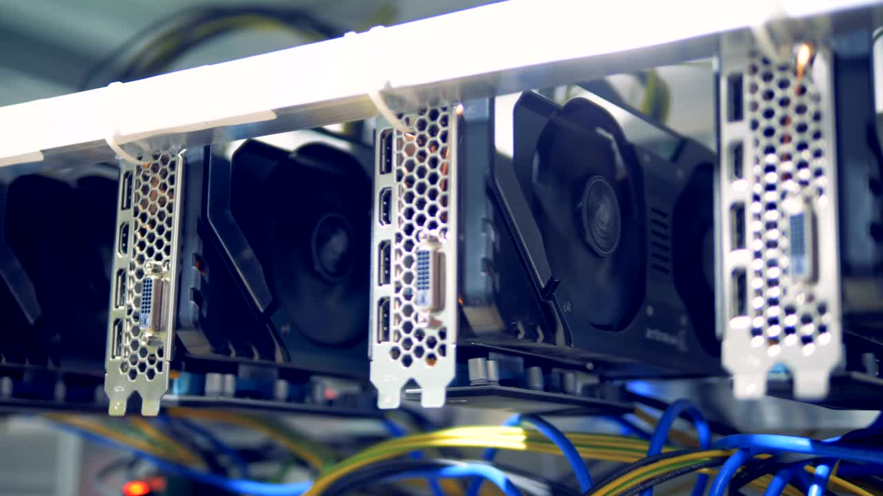 Rotating reels of graphic cards during cryptocurrency mining
