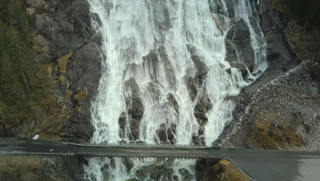 Close-Up-Pull-Back-Shot-of-the-Famous-Furebergfossen-Waterfall-in-Norway,-Aerial-View