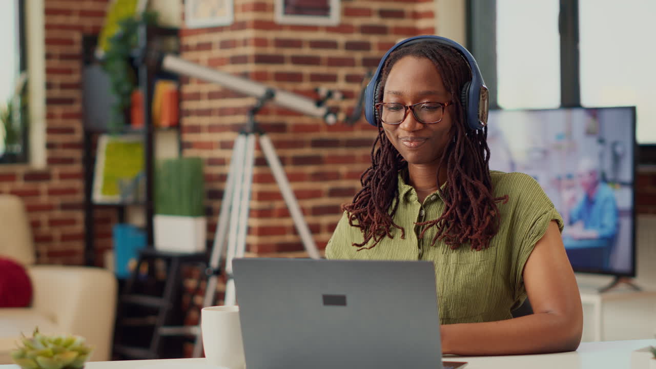 Young student attending videocall conference online on laptop