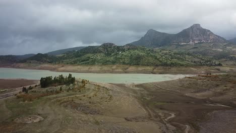 vast wetlands and majestic mountains in horizon, aerial drone view