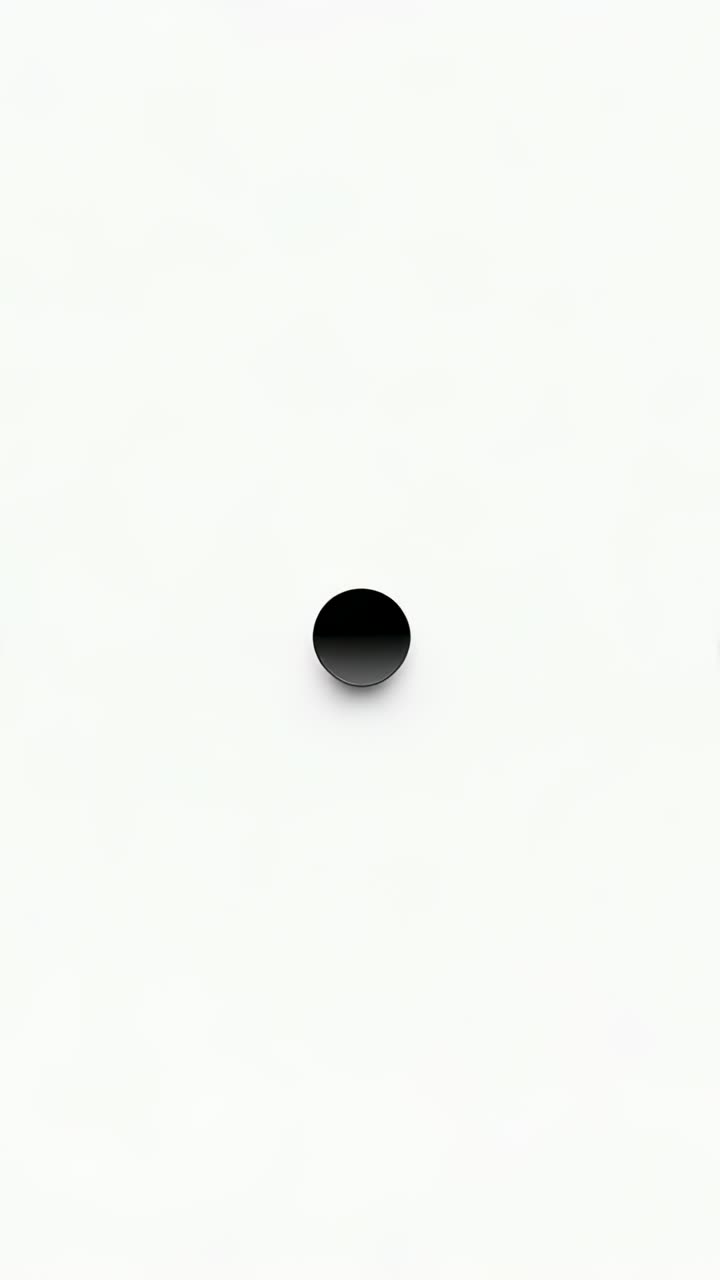 Vertical video: Starting sequence central disc scaling darkening on white with edge discs for focus