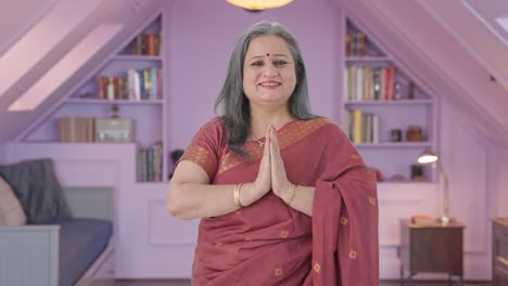 Happy-Indian-old-woman-doing-Namaste-and-greeting-guests