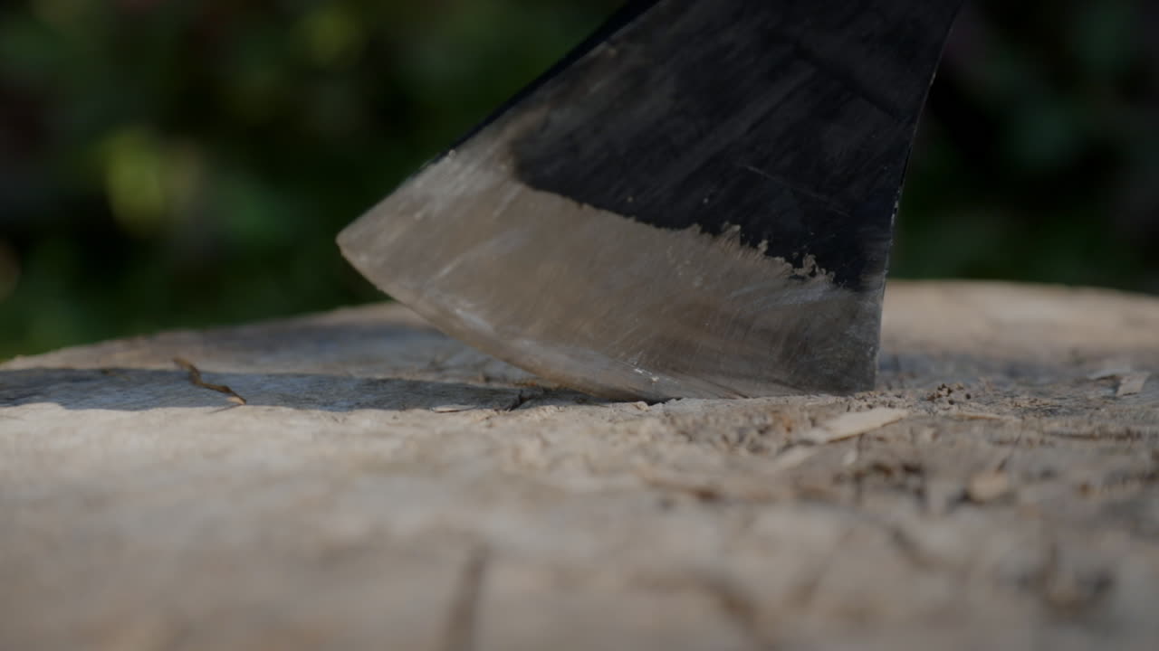 A man picks up the axe