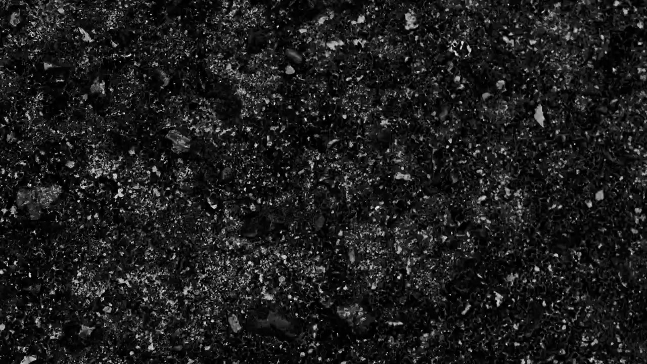 Abstrakt svart-hvitt grovkornet teksturert overflate