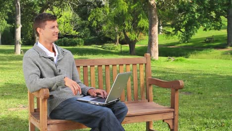 young man chatting on his laptop