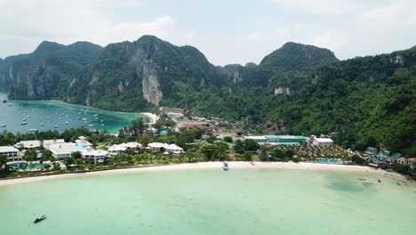 Aerial-View-on-Koh-Phi-Phi-Don-Island-Double-Bay,-Beach-and-Harbor,-Popular-Exotic-Tourist-Destination-in-Krabi-Province,-Thailand