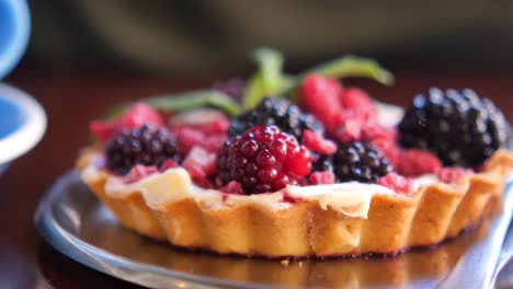 close-up of a delicious fruit tart with blackberries and raspberries