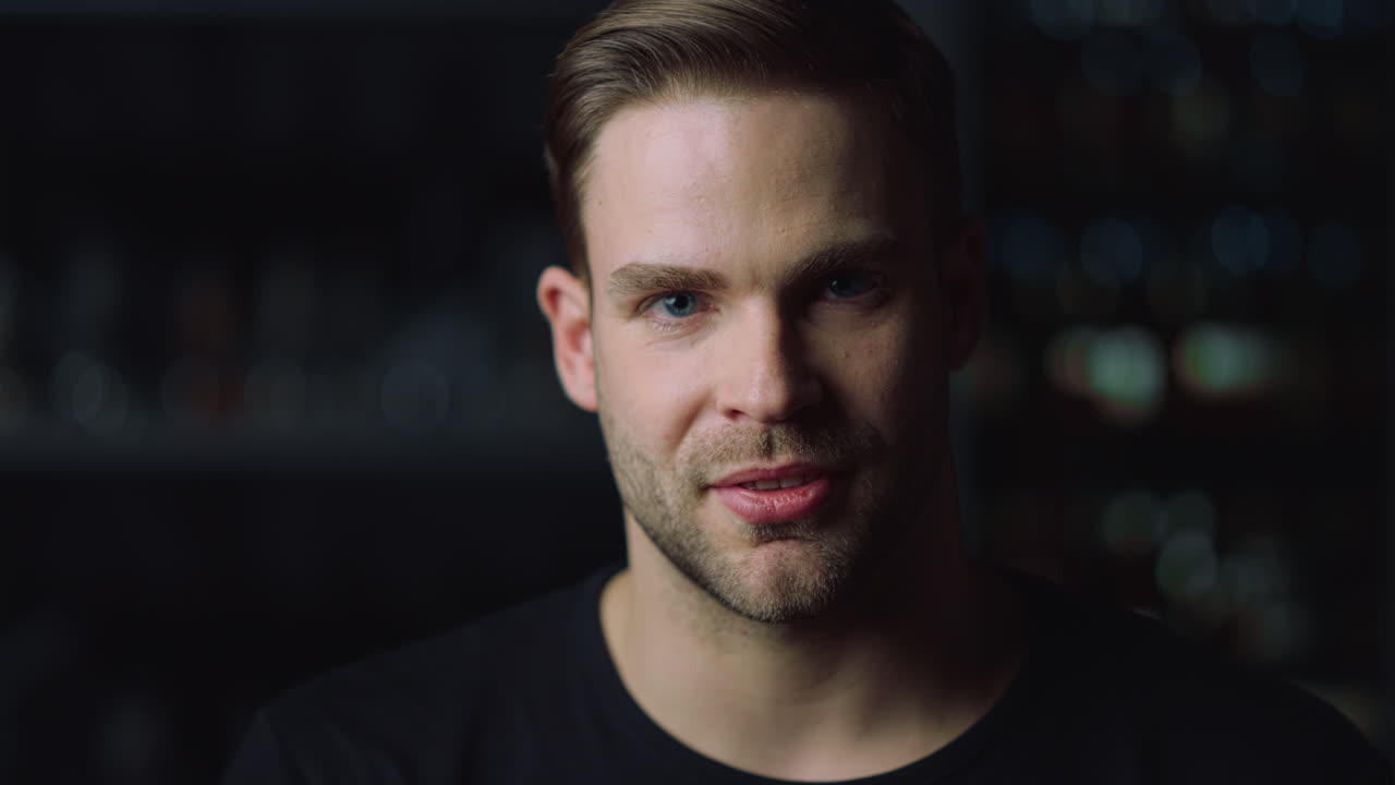 Head shot portrait of handsome man looking at camera indoors.Person interviewing