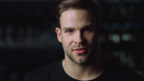 head shot portrait of handsome man looking at camera indoors.person interviewing