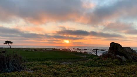 a time lapse video of a magnificent sunset from pebble beach, california