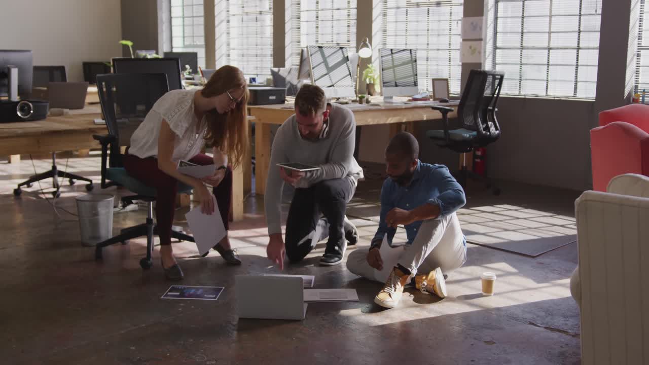 Young creative professionals working in a modern office