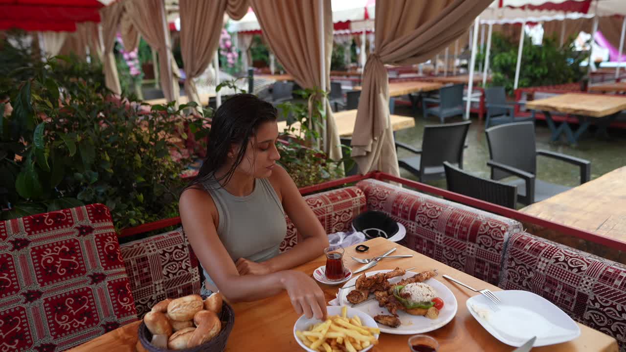 Woman Eating Lunch at a Turkish Restaurant