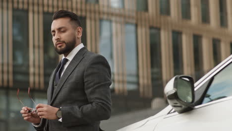 confident businessman posing outdoors