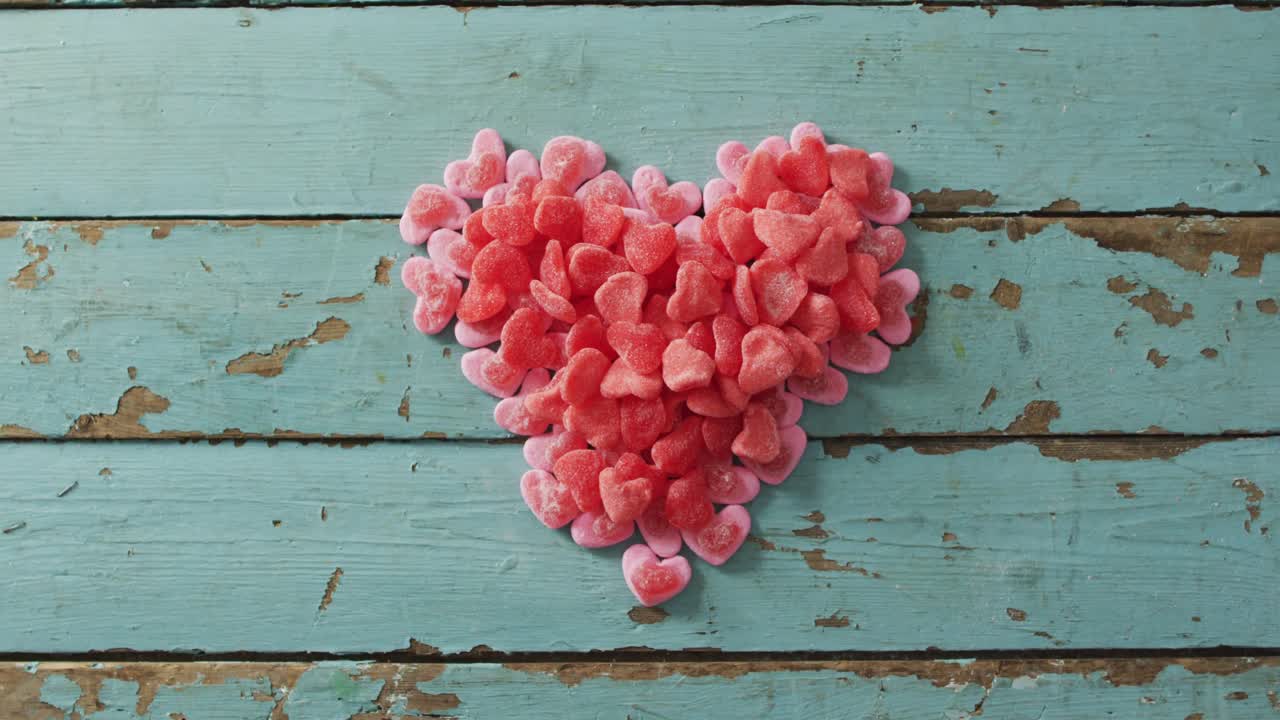 Heart shape sweets on wooden background at valentine's day