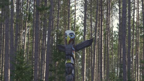 closeup shot of a aboriginal totem pole in algonquin provincial park, canada