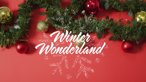 animación del texto del país de las maravillas de invierno sobre decoraciones navideñas