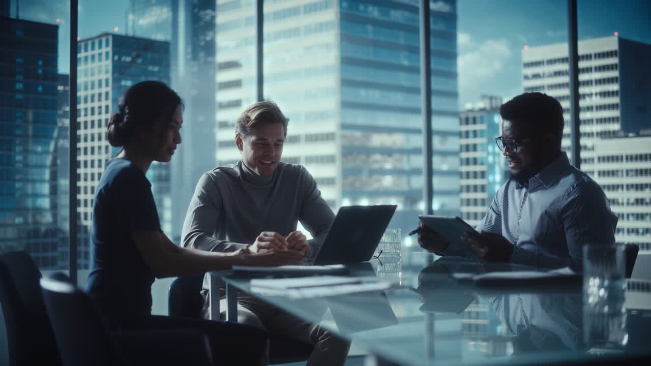 Multiethnic Diverse Office Conference Room Meeting: Team of Three Creative Entrepreneurs Talk, Discuss Growth Strategy. Stylish Young Businesspeople Work on Digital e-Commerce Startup Project.