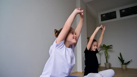 girls exercising in yoga class