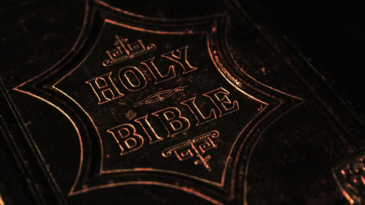 close up of the holy bible with a dark background