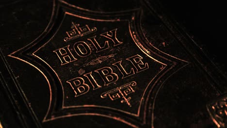 close up of the holy bible with a dark background