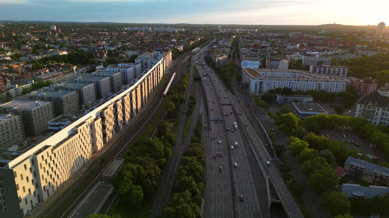 Aerial view of a city with a highway and railway