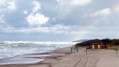 Dramatic-Coastal-Beauty:-Waves,-Rainbow,-and-Ocean-Majesty-in-Palanga,-Lithuania