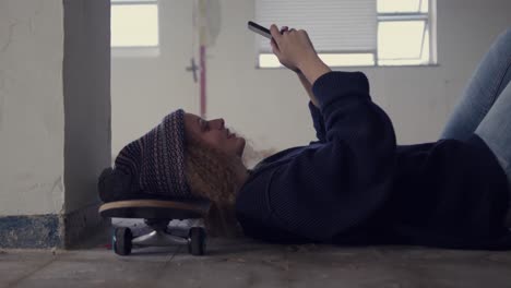 fashionable young woman in an abandoned warehouse