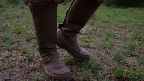 a hunter walking through the woods