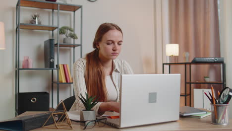 Tired-woman-teacher-using-laptop-computer-with-funny-stickers-on-eyes-sleeps-at-workplace,-napping