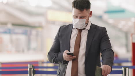businessman with suitcase at check-in