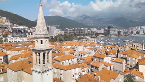 backward drone flight reveals historic church tower in montenegro