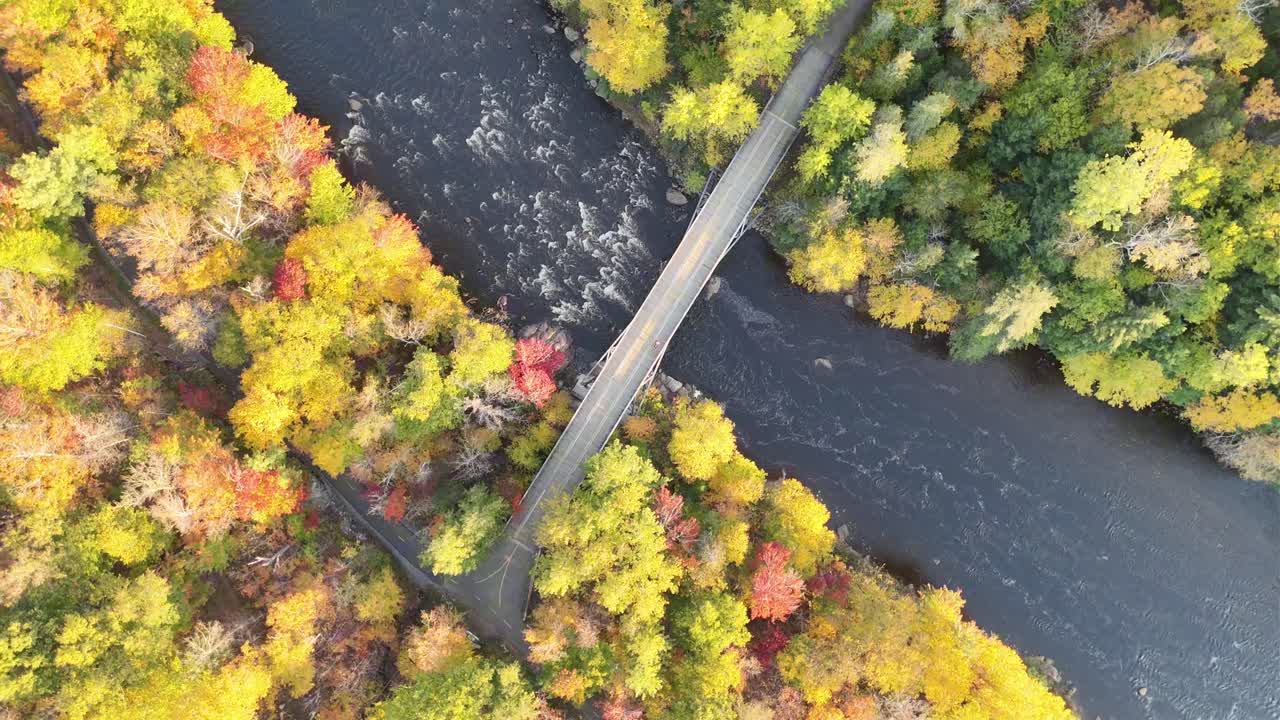 Overhead shot 360-degree movement of a bridge in autumn.