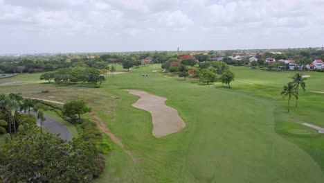 aerial ascending view of golf course at la romana in dominican republic