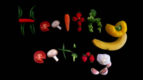 healthy eating animated background with fresh strawberries, carrots and mushrooms. fun stop motion animation with pretty design artwork crafted from the vegetables