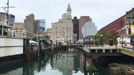boston harbor, massachusetts.  pier, cityscape, pleasant summer day, clouds, view from water