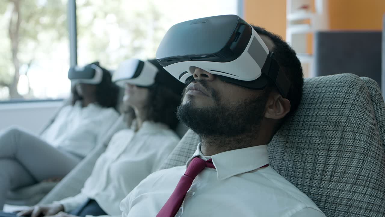 Relaxed young man in vr headset