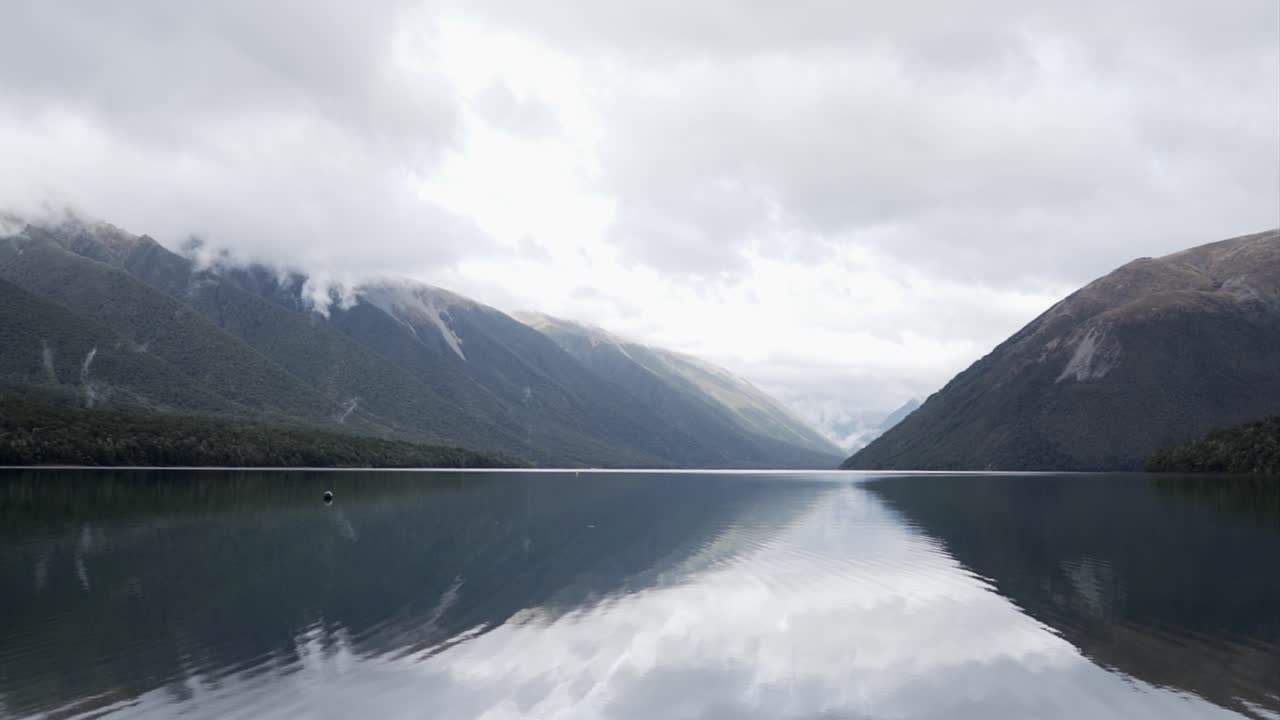 Lake with Mountain Reflections on a Cloudy Day