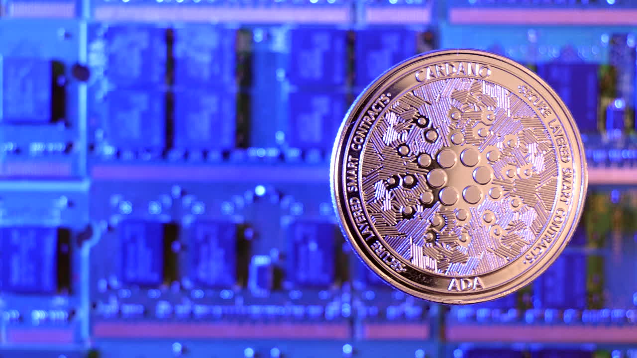 A close tracking shot of Cardano ADA crypto currency coin hovering over a mining rig of computer chips