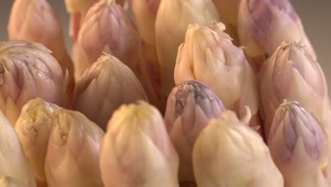 portion of fresh white asparagus on turn table