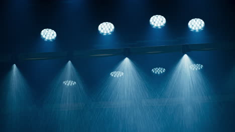 a special effects rain machine in a film cinema studio with a ceiling full of film lights