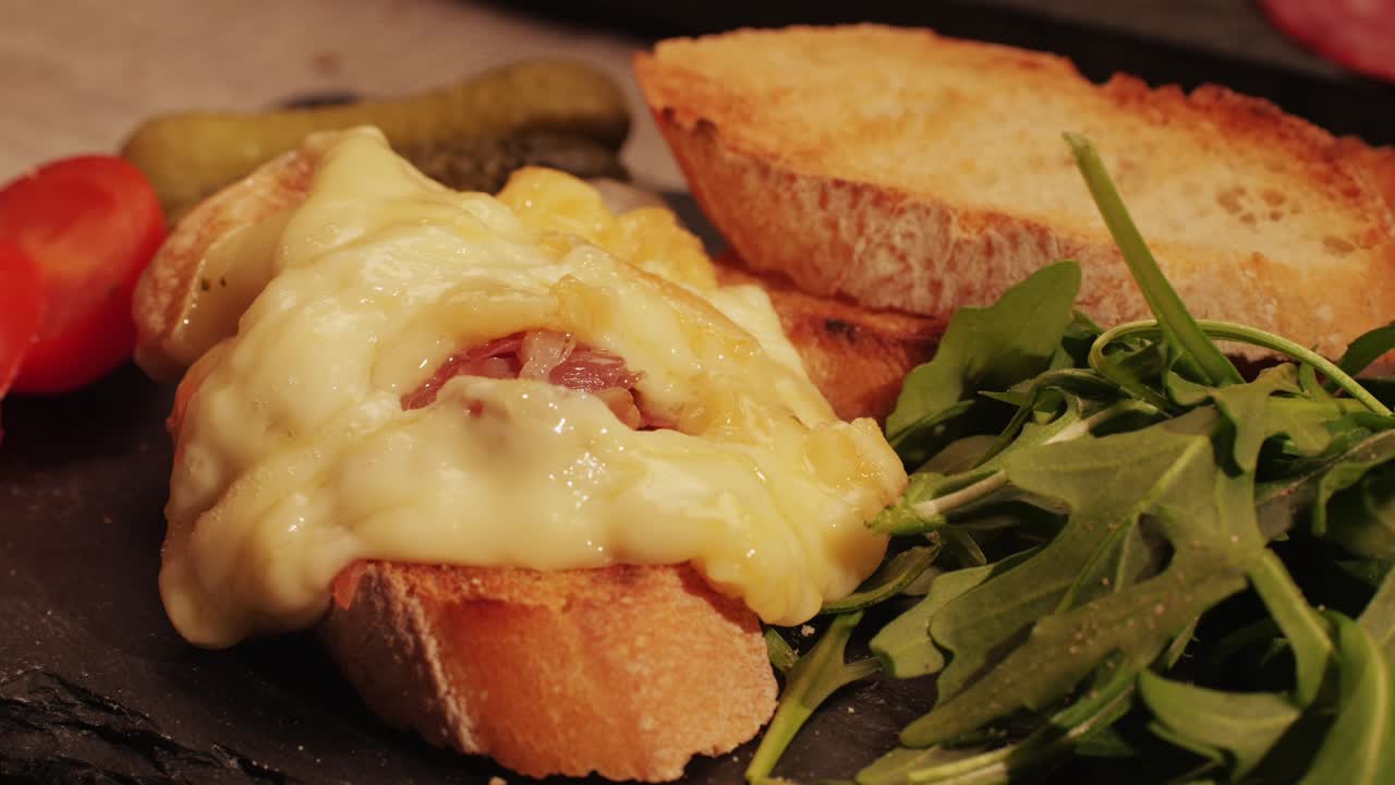 French Swiss or Spanish restaurant with traditional tapas food, Spanish cuisine, delicious tapas and cheese plate, bruschetta with cheese, olives dry tomatoes and tasty sandwich bar appetizer, buffet