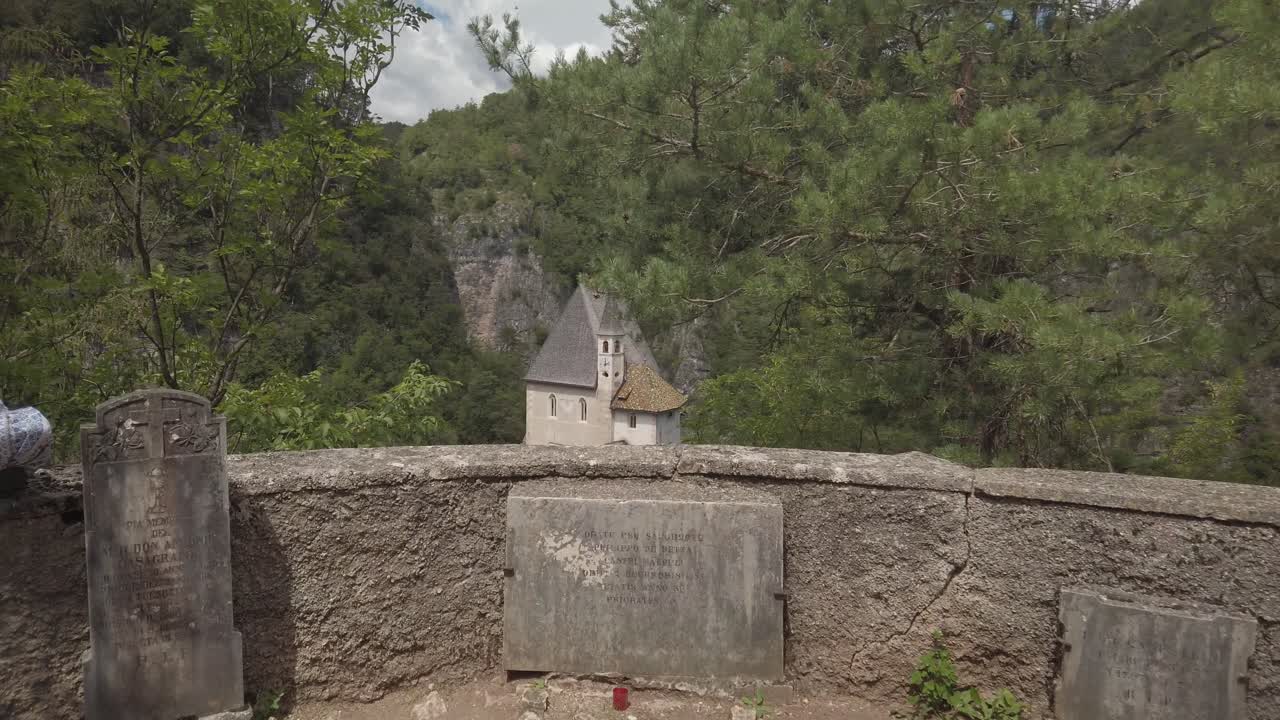 Sanctuary of San Romedio on a steep rocky spur in natural scenery. Panoramic view from top of Romedio shrine on a hill.St. Romedio Sanctuary in San Zeno, Val di Non, Trentino, Italy.