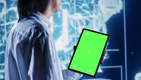 supervisor uses chroma key tablet for ai