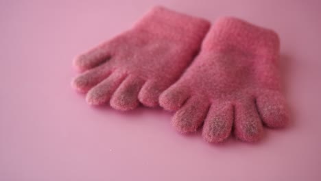 pair of pink fingerless gloves