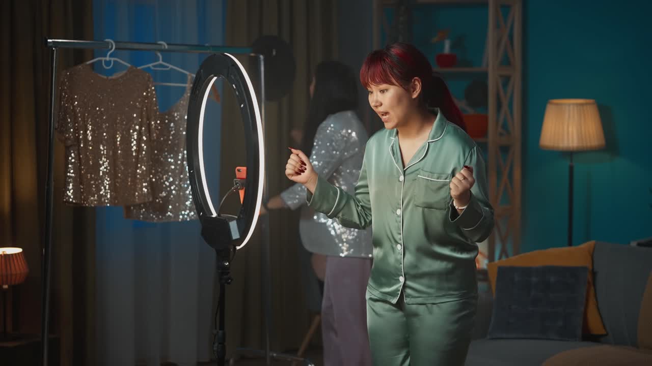 Fashion Show by Two Women in Pajamas