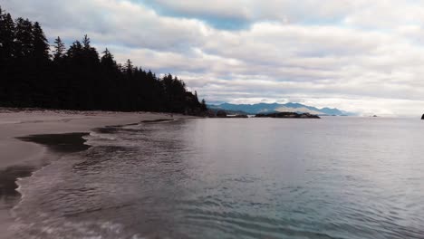 Beautiful-Beach-front-low-flying-aerial-scene-on-very-remote-West-Coast-uninhabited-beach