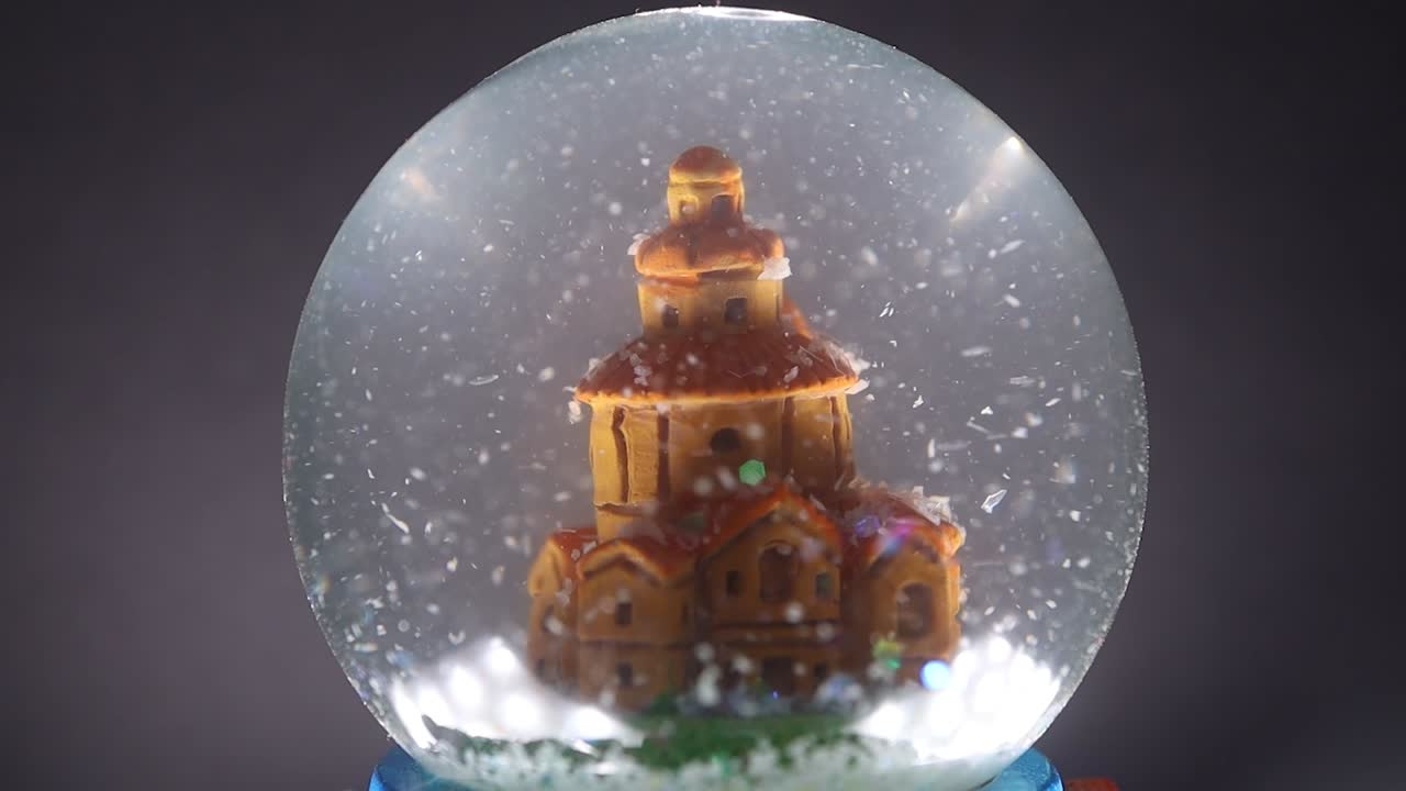 Close-up of a Snow Globe with a Miniature Building