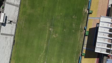 multiple aerial views of an empty stadium, showcasing the playing field and seating arrangements from various perspectives
