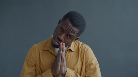 man with hands together