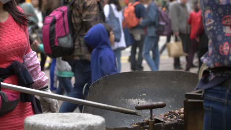 cooking chestnuts at street stall